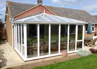 Conservatory finished with a light neutral film to stop heat, glare and fading